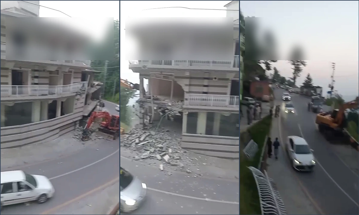 ایوبیہ میں تجاوزات کے خاتمے کے آپریشن کے دوران بھاری مشینری کے ذریعے کمرشل عمارت کا حصہ گرایا جا رہا ہے۔