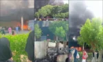 گورنمنٹ کالج ویمن یونیورسٹی فیصل آباد کی پارکنگ میں آگ لگنے کے بعد اٹھنے والے دھوئیں کے بادل اور تباہ شدہ بس کا منظر
